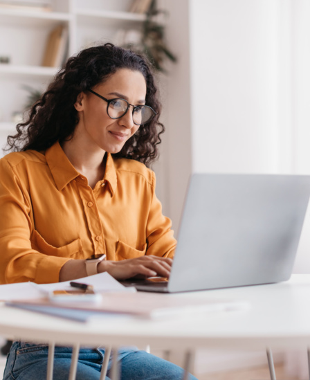 Middle Eastern Lady Using Laptop Working Online Sitting In Office